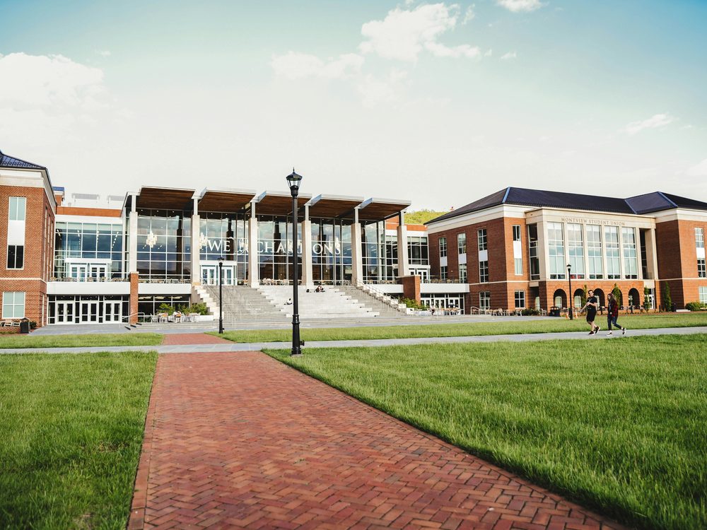 Modern school campus exterior representing RASSEDCO Education's institution-building work.